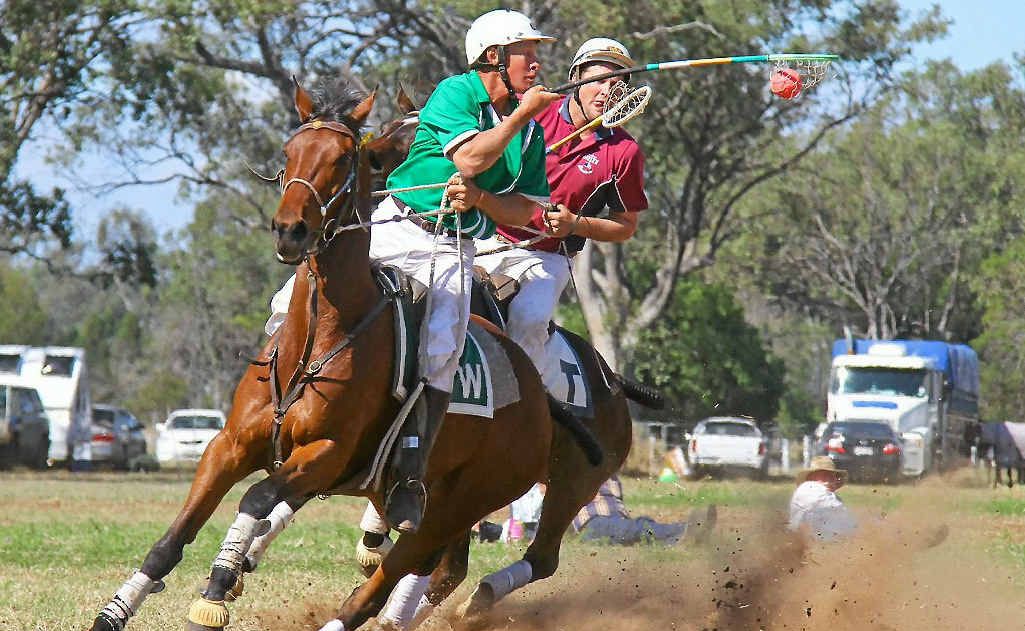Queensland captain and Warwick 1 player Paul McGrath (with ball) on the way to an A-grade state championship victory with the Warwick polocrosse club. Queensland captain and Warwick 1 player Paul McGrath (with ball) on the way to an A-grade state championship victory with the Warwick polocrosse club.